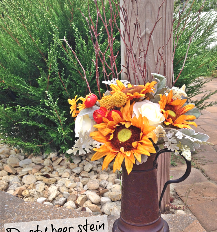Rusty beer stein plus faux flowers equals Fall!