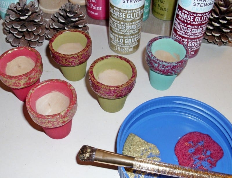 add glitter to mini pinecone tree pots