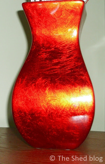 red vase used for both Christmas decor and Valentine's Day