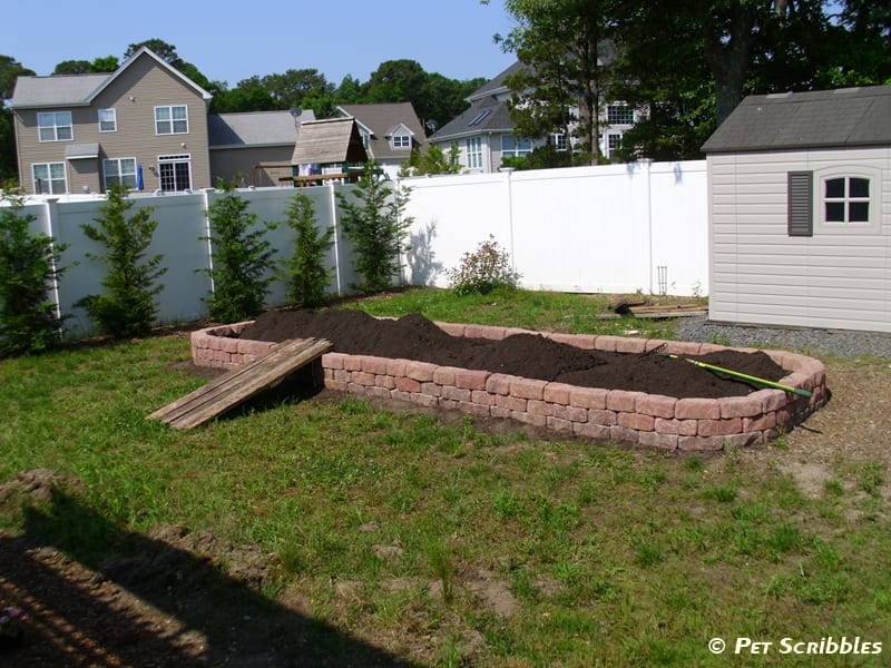DIY Raised Vegetable Bed, close up of three levels of pavers installed