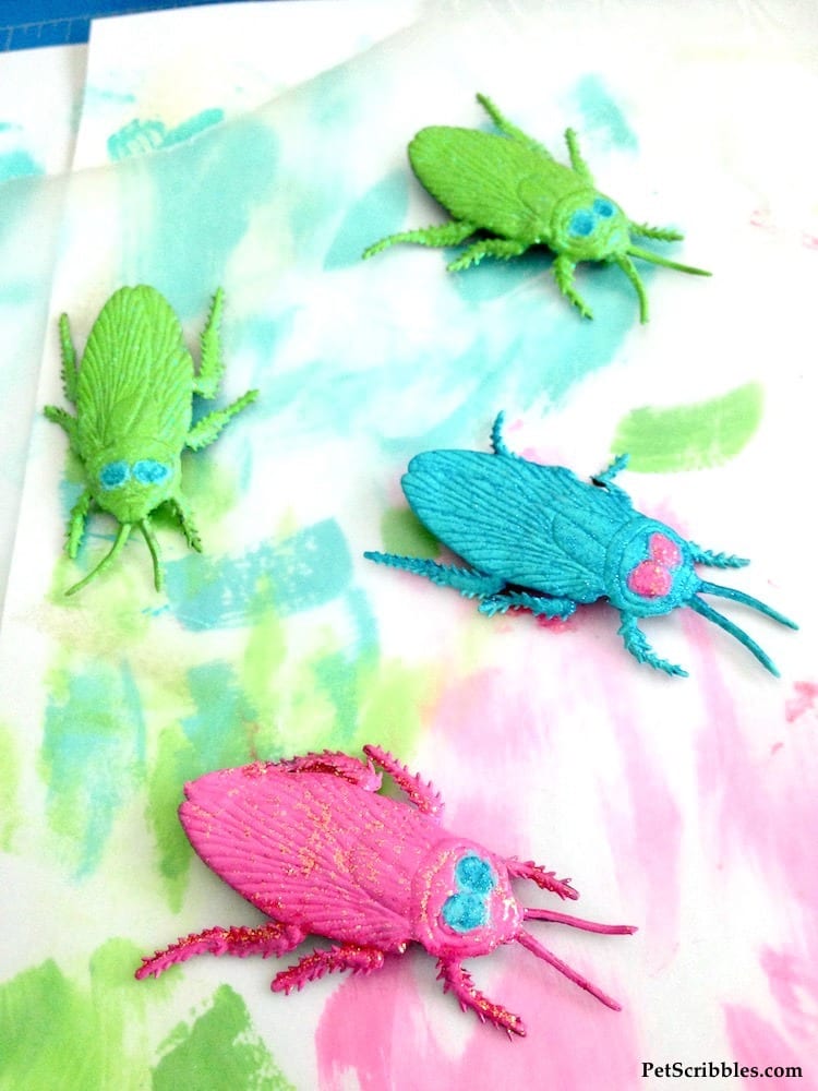 dollar store plastic Halloween bugs painted in pretty colors