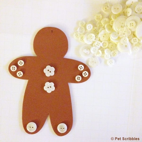 adding buttons to gingerbread men ornaments