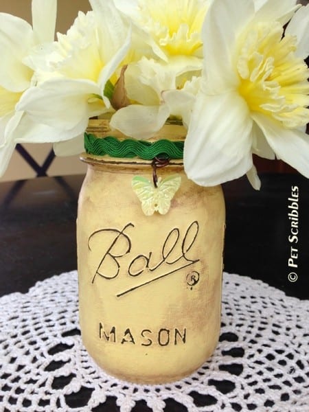 Distressed mason jar vase with flowers