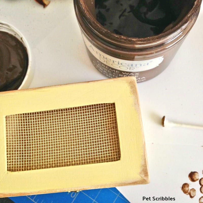 applying brown wax to chalk painted box