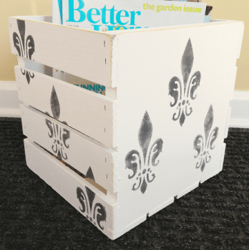 Paint a wooden crate for stylish magazine storage!