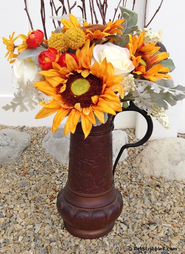 Rusty beer stein plus faux flowers equals Fall!