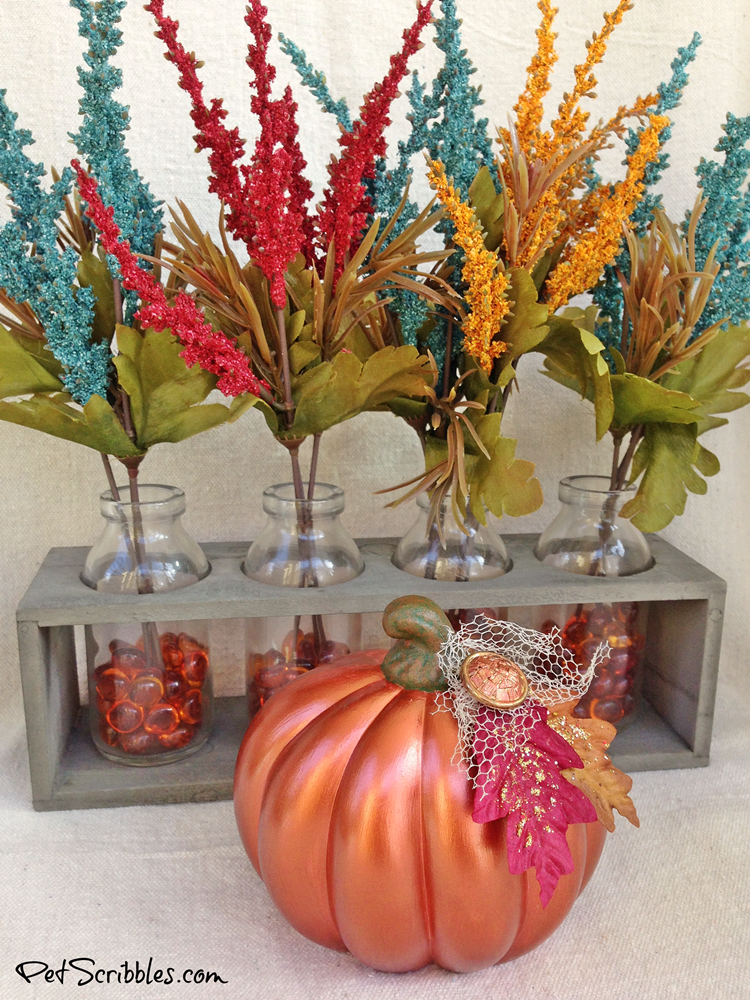 pretty repainted pumpkin in a Fall home decor display