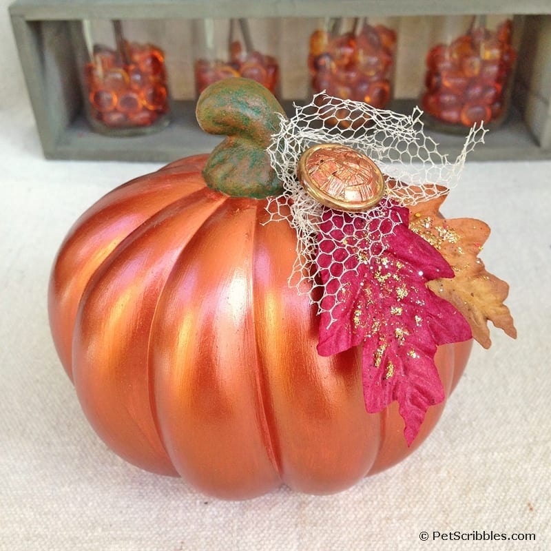 pretty copper metallic pumpkin with Fall leaves