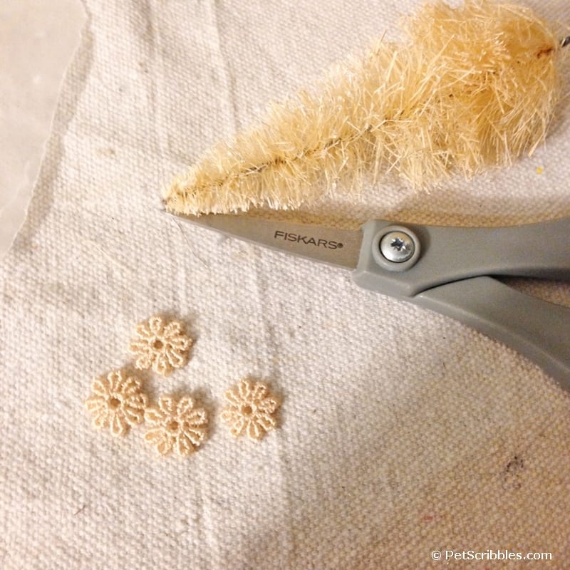 cutting up a scrap piece of lace