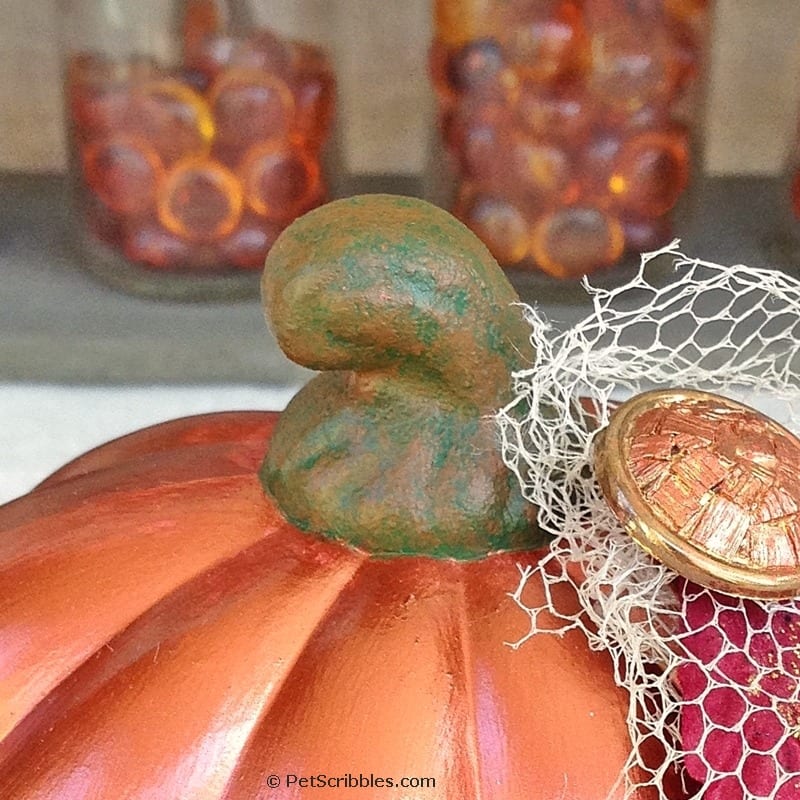 closeup of a painted stem on a fake craft pumpkin