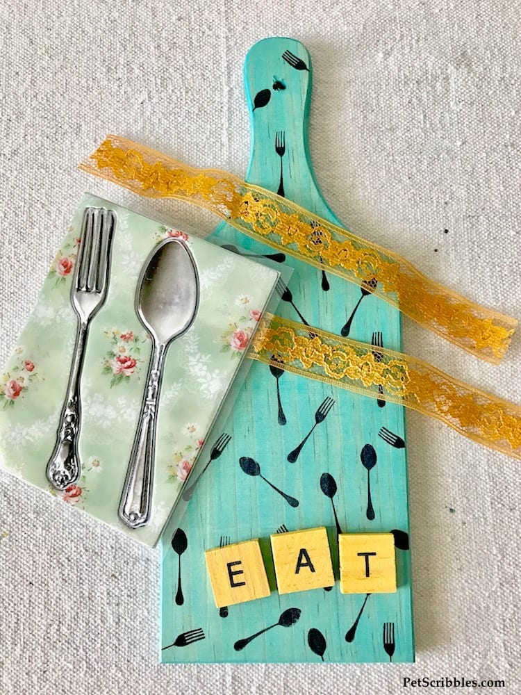 Make this colorful Fork and Spoon Kitchen Art using vintage adhesive embellishments instead of actual utensils! Yes, the fork and spoon are dimensional stickers! So fun and so many possibilities!