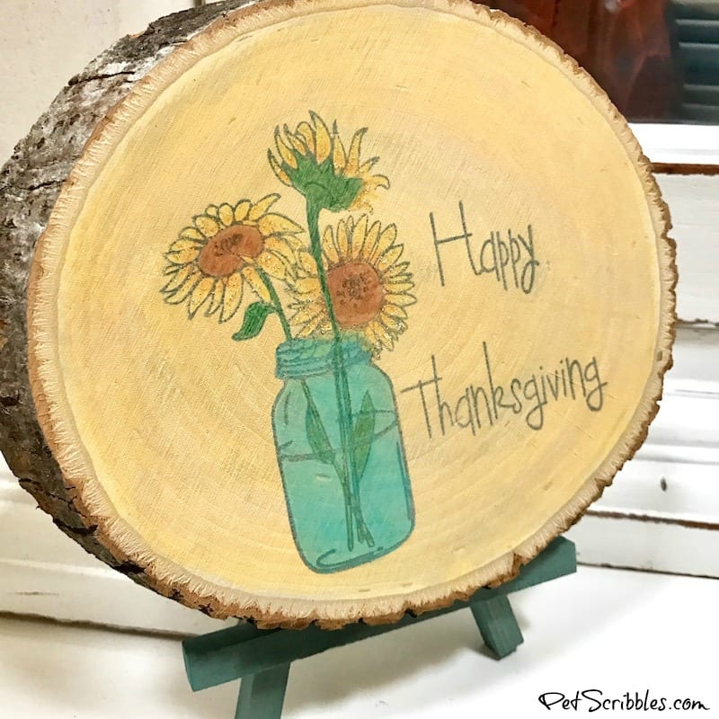 rustic wood slice with sunflowers and mason jar design