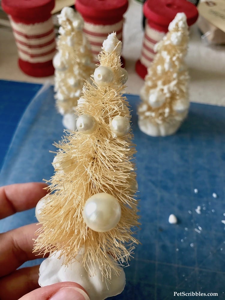 adding fake snow to ivory bottle brush trees