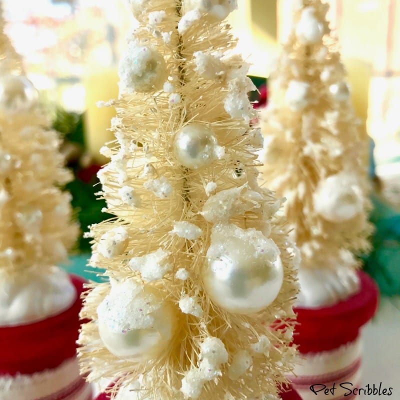 fake snow and pearl beads on ivory bottle brush trees