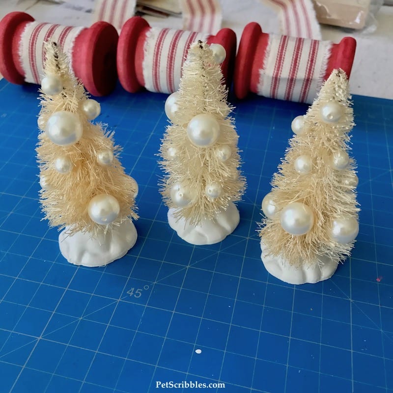 pearl beads attached to ivory bottle brush trees