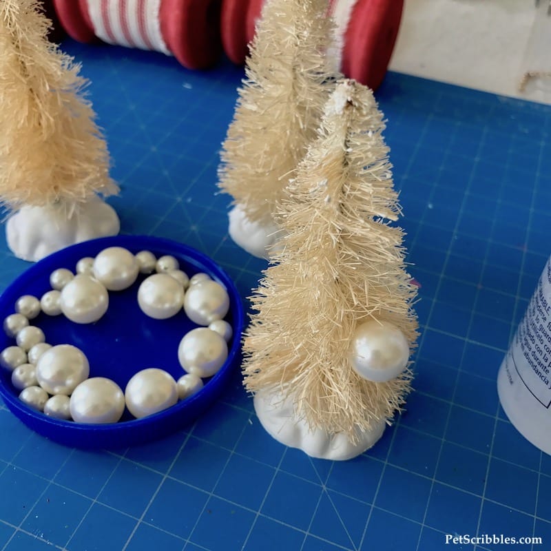 attaching fake pearls to ivory bottle brush trees