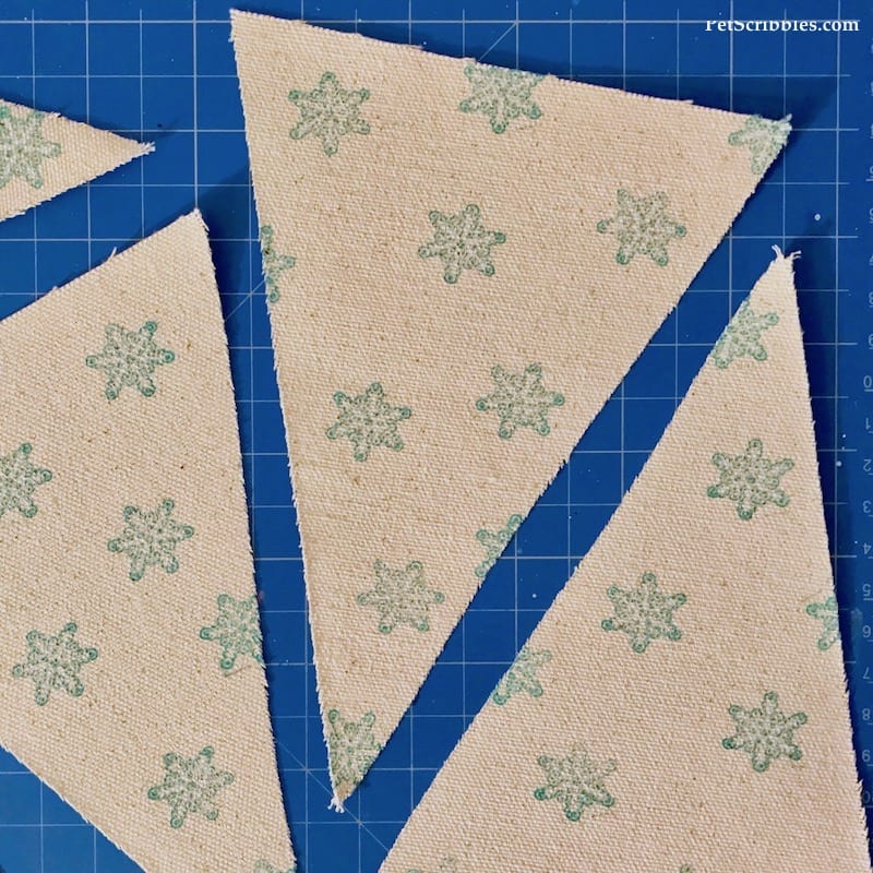 snowflake stamped design on canvas pennants