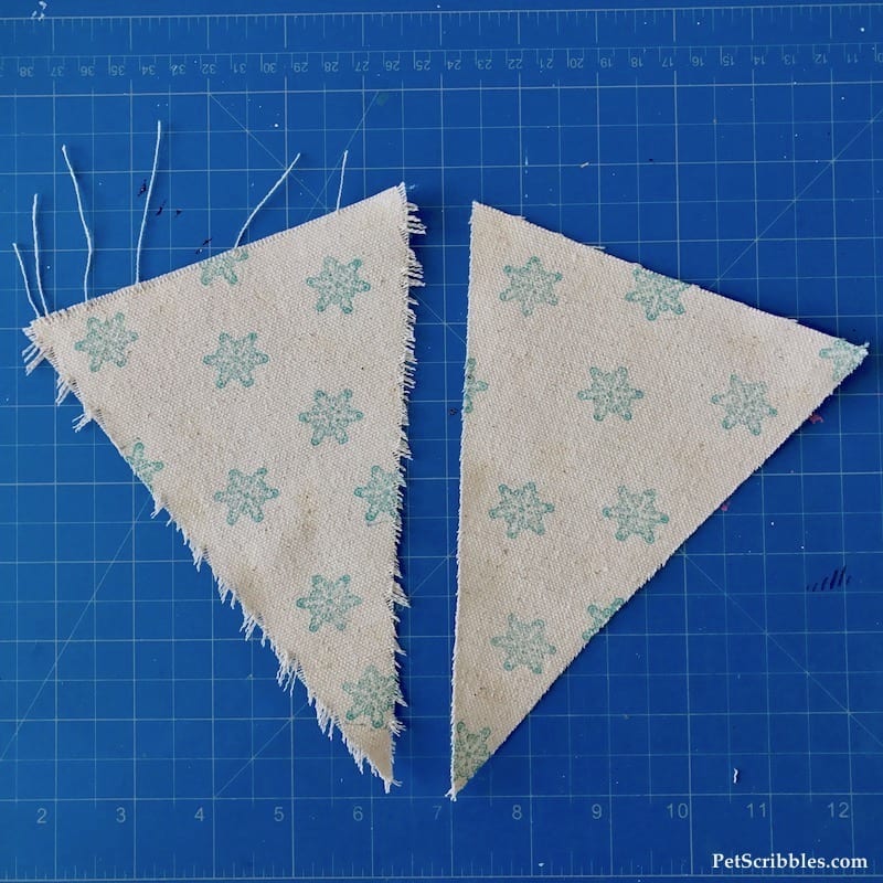 frayed edges of a canvas banner triangle