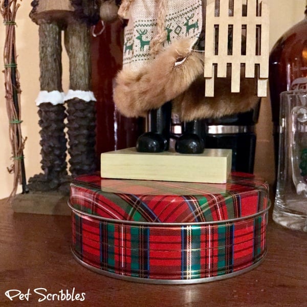 use cookie tins to elevate nutcrackers