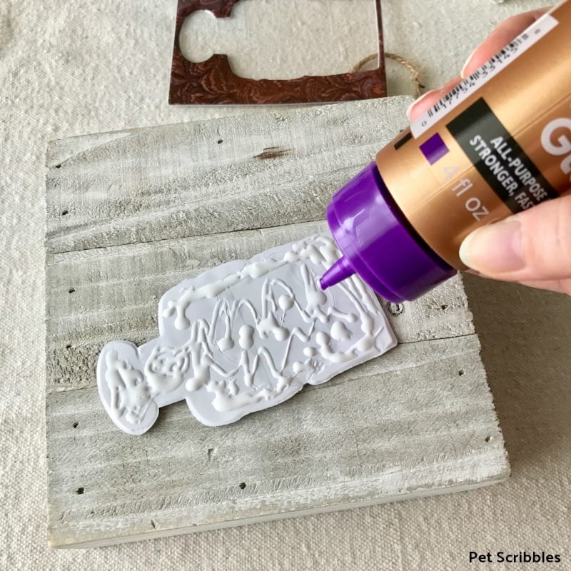 use glue to secure dimensional stickers to wood