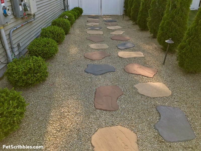 no grass side yard using decorative gravel and pavers