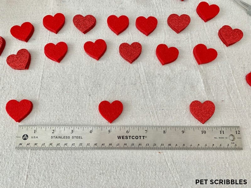 measuring out hearts for felt heart garland