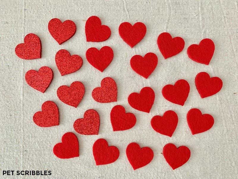 Red felt hearts used to make easy no-sew felt heart garland