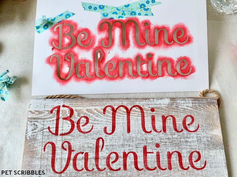 stenciling a rustic wood Valentine's Day sign