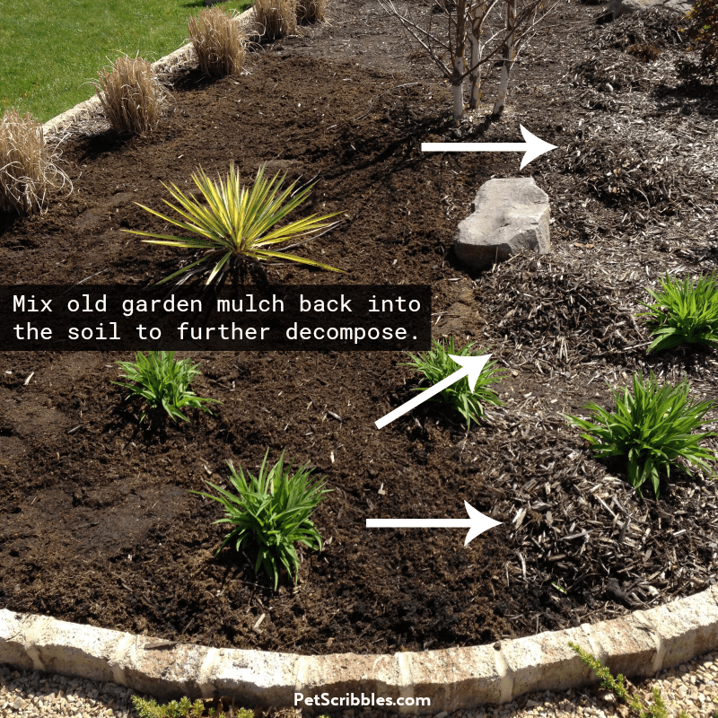 piles of old mulch ready to mix back into the garden