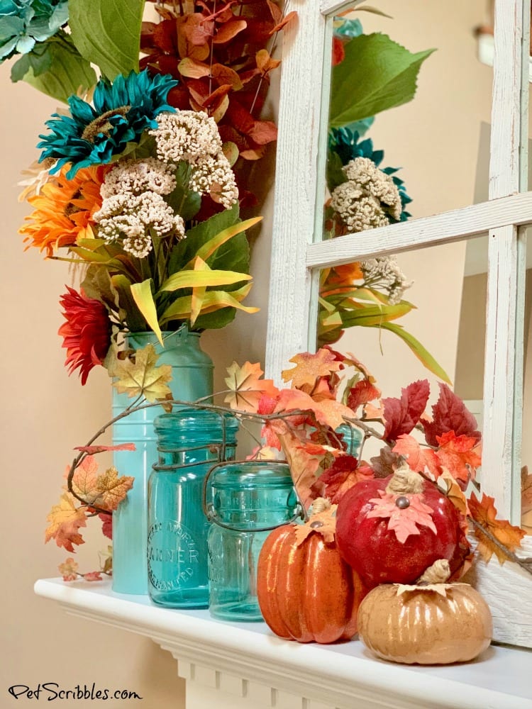 Fall mantel with antique mason jars and pumpkins