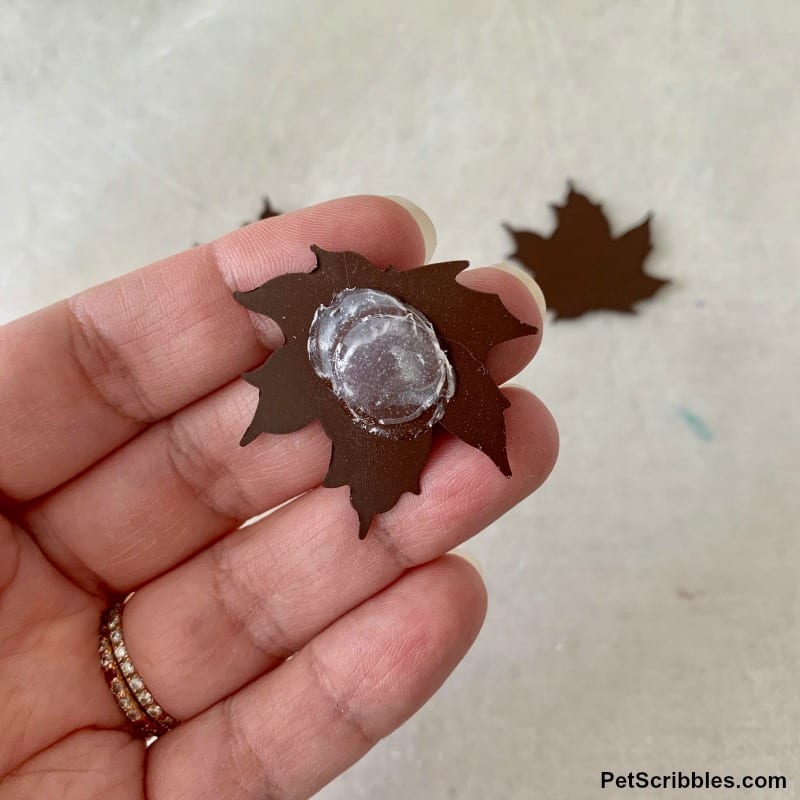 glue dots on the backs of rustic tin leaves for crafting