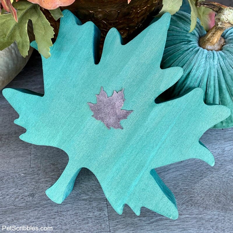 teal painted wooden leaf