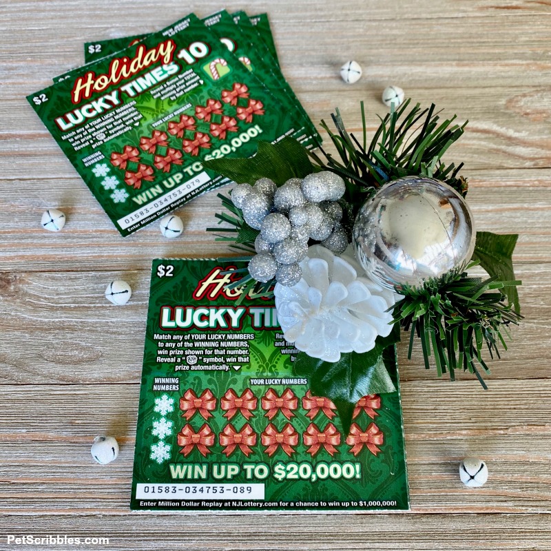 Holiday Lucky Times 10 Lottery Game with festive holiday magnet clip attached