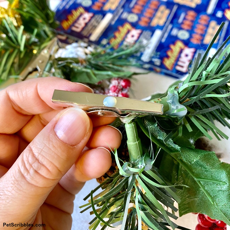 adding glue to back of ornament clip