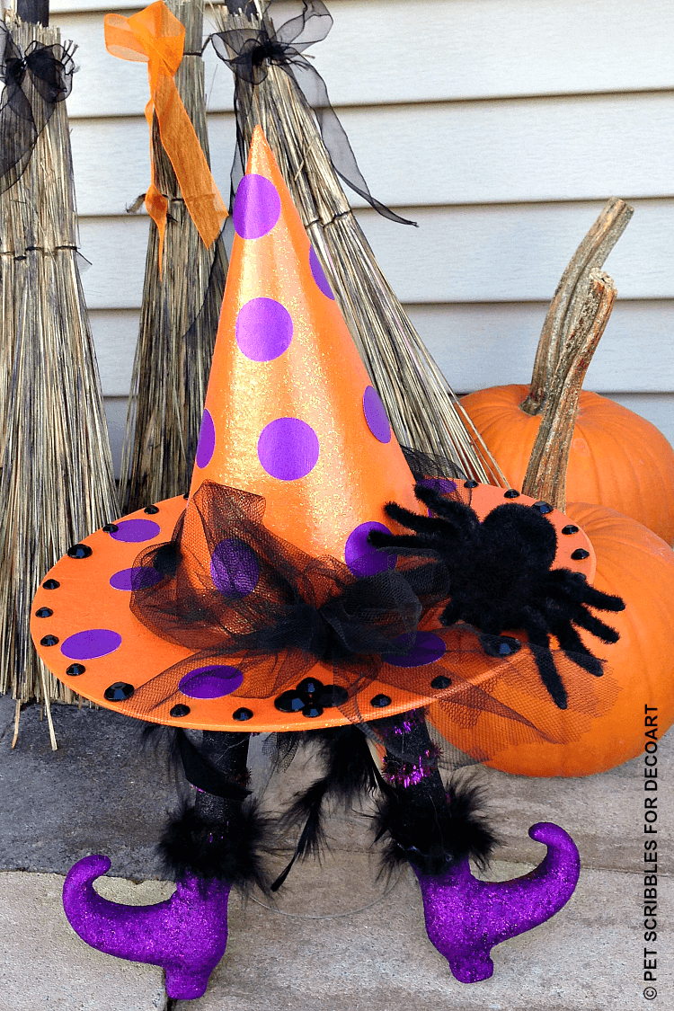 witch legs for crafts shown propped underneath a witch hat