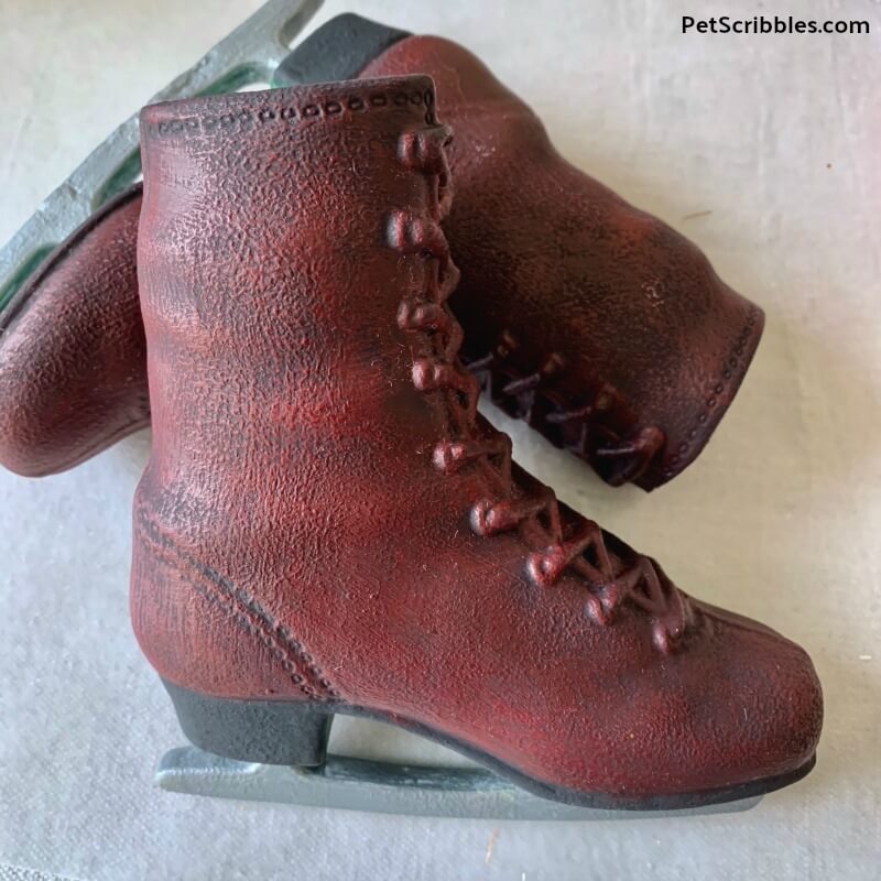 distressed red painted ice skates