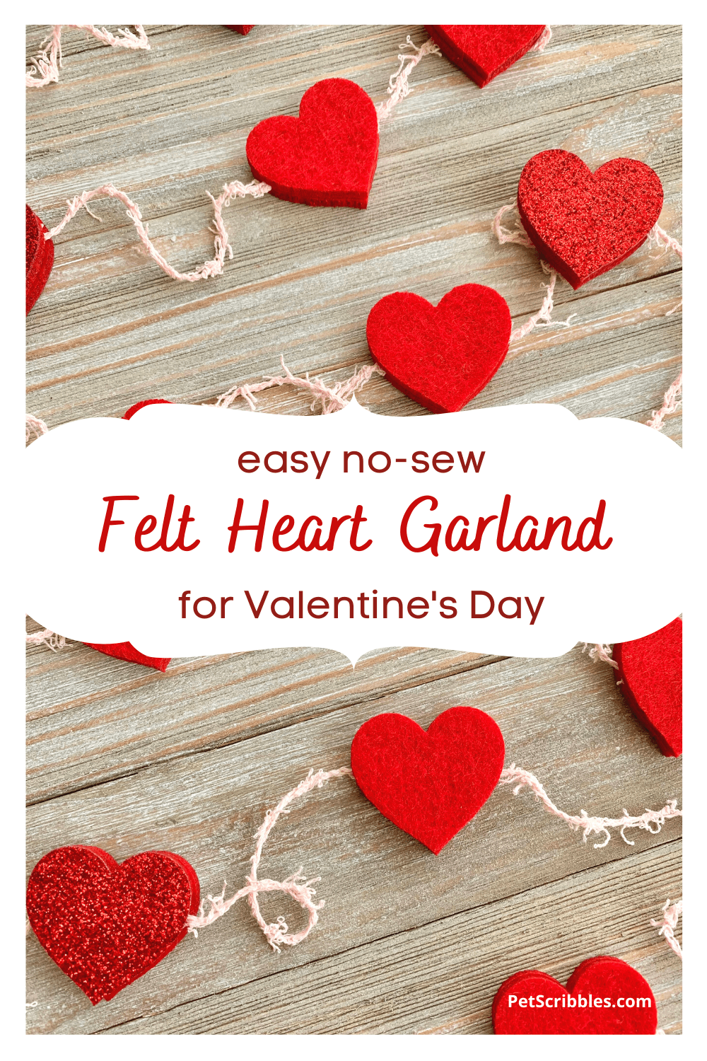 red felt heart garland on wood pallet
